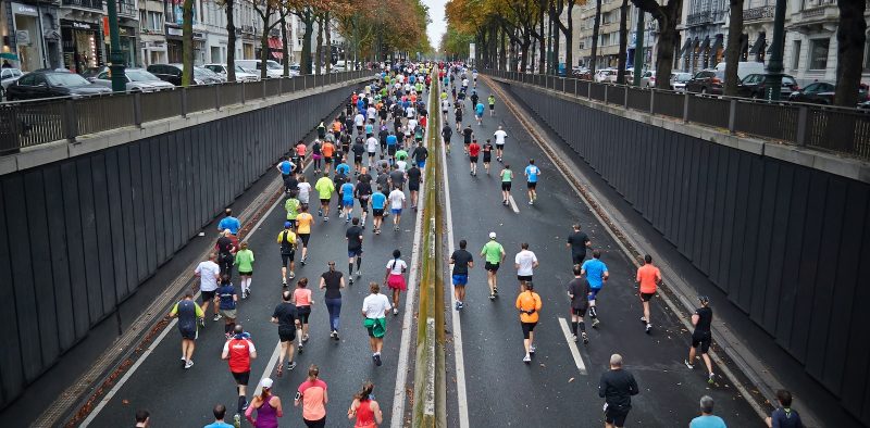 people running on road during daytime